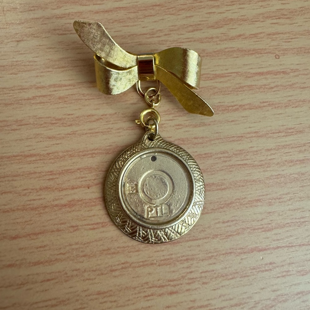 Vintage Gold tone Bow brooch w/ circle frame photo locket